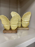 Yellow Butterfly On Wood Base